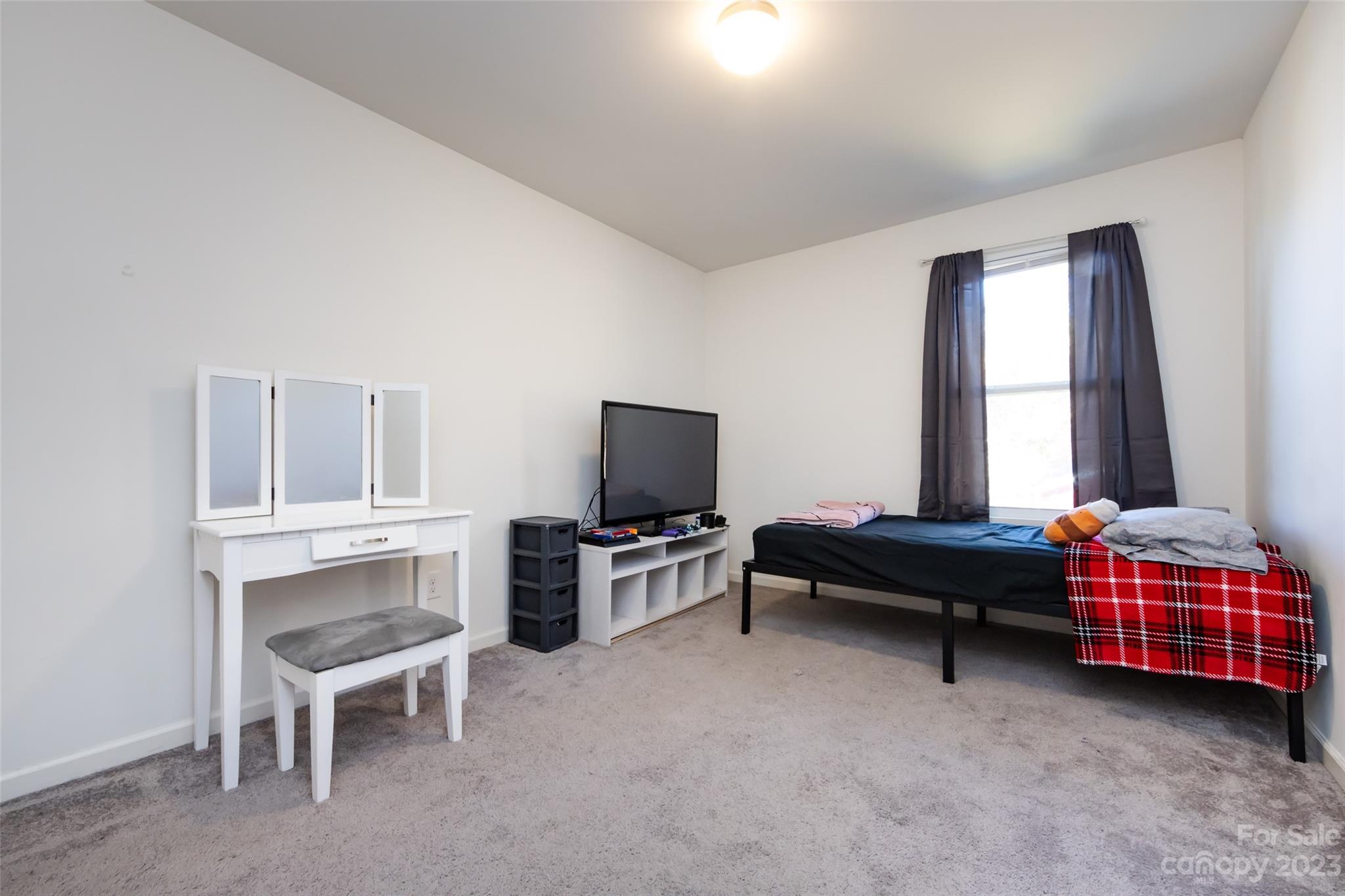 3823 Tersk Drive Midland, NC 28107 - Photo 13 of 24 a bedroom with furniture and a window
