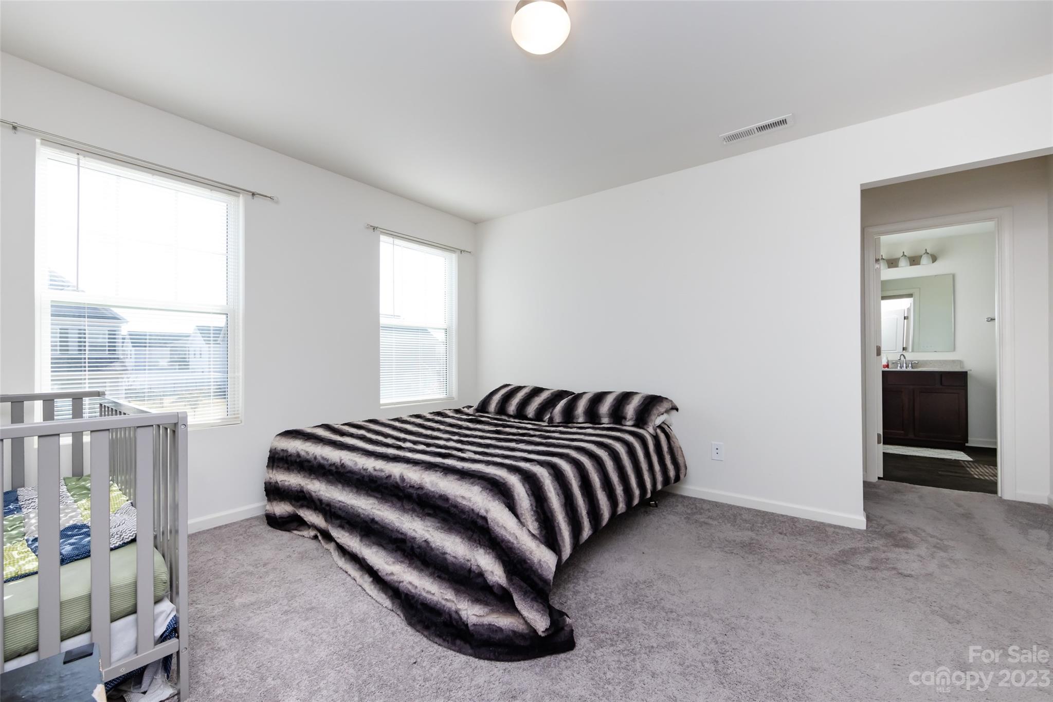 3823 Tersk Drive Midland, NC 28107 - Photo 16 of 24 a bedroom with a bed and a window