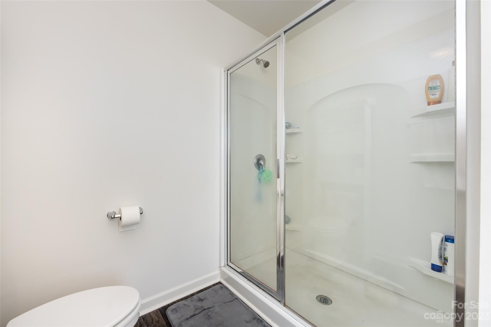 3823 Tersk Drive Midland, NC 28107 - Photo 18 of 24 a bathroom with a shower and a toilet