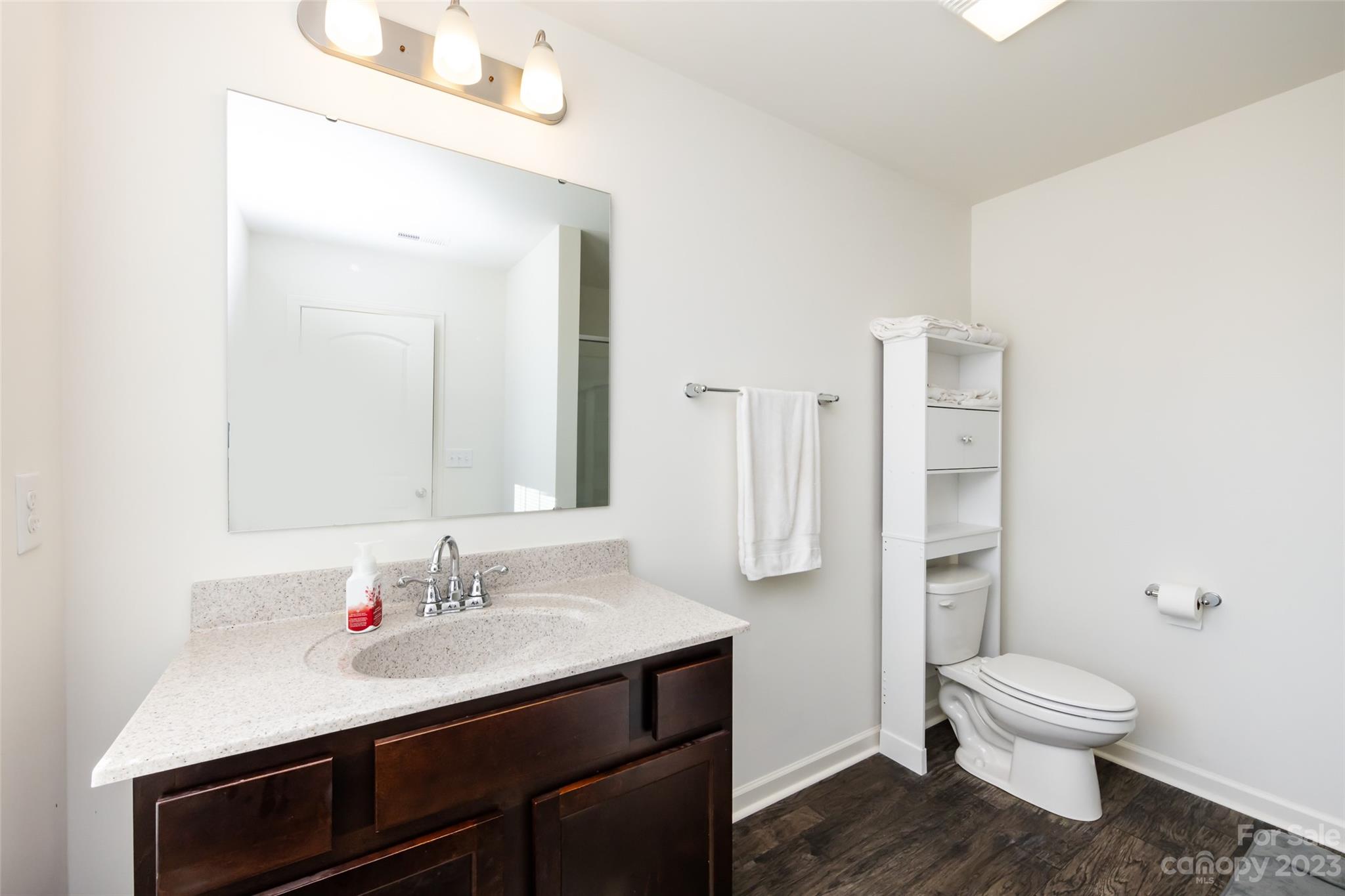 3823 Tersk Drive Midland, NC 28107 - Photo 19 of 24 a bathroom with a sink a toilet and shower