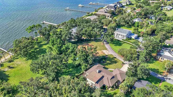 an aerial view of a house with a yard and garden