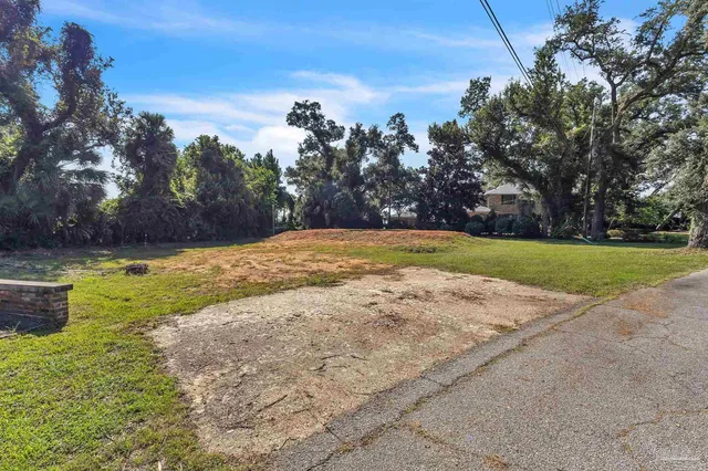 a view of a swimming pool with an outdoor space and seating area