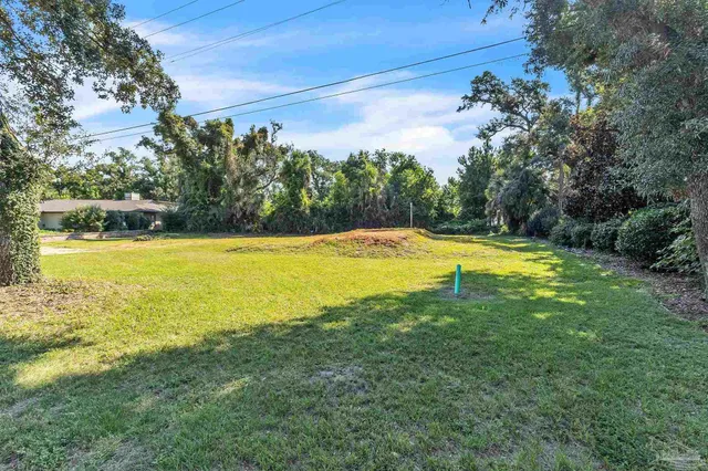 a view of a swimming pool with an outdoor space and seating area