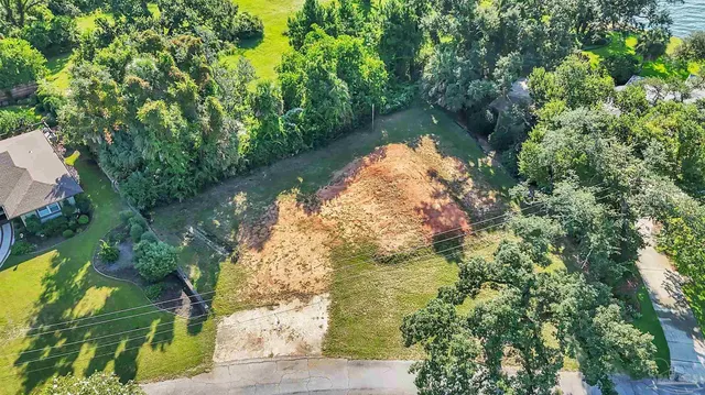 a view of a lake with a yard