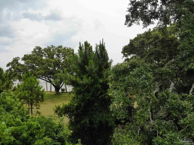 a view of a lake with houses in back