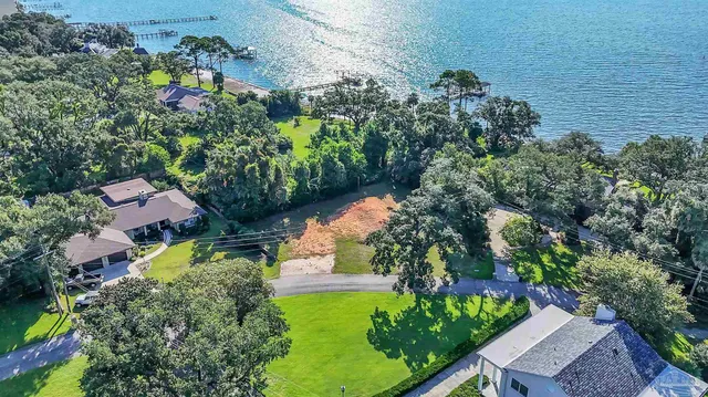 an aerial view of residential house with outdoor space and swimming pool