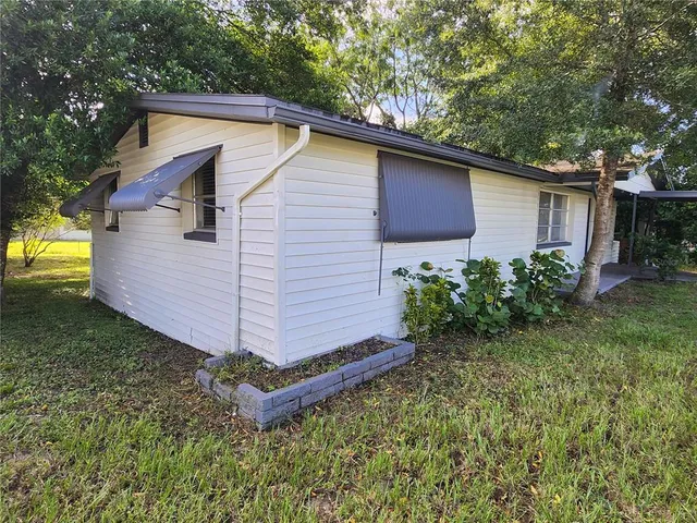 a backyard of a house with lots of green space