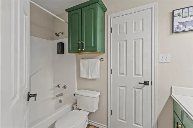 a bathroom with a toilet a sink and bath tub