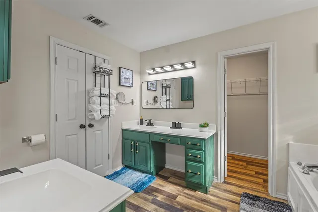 a spacious bathroom with a sink a toilet and shower