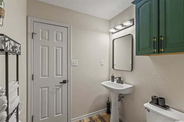 a bathroom with a sink a mirror and vanity
