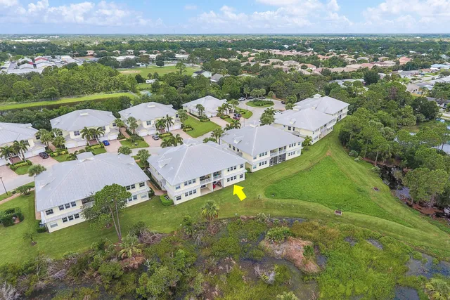 an aerial view of a house with a garden