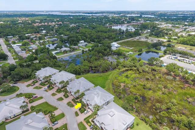 an aerial view of residential houses with outdoor space