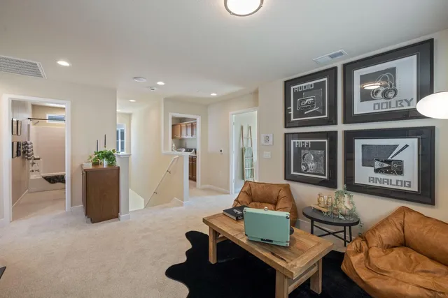 a living room with furniture and a table