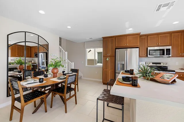 a room with furniture a rug and a window