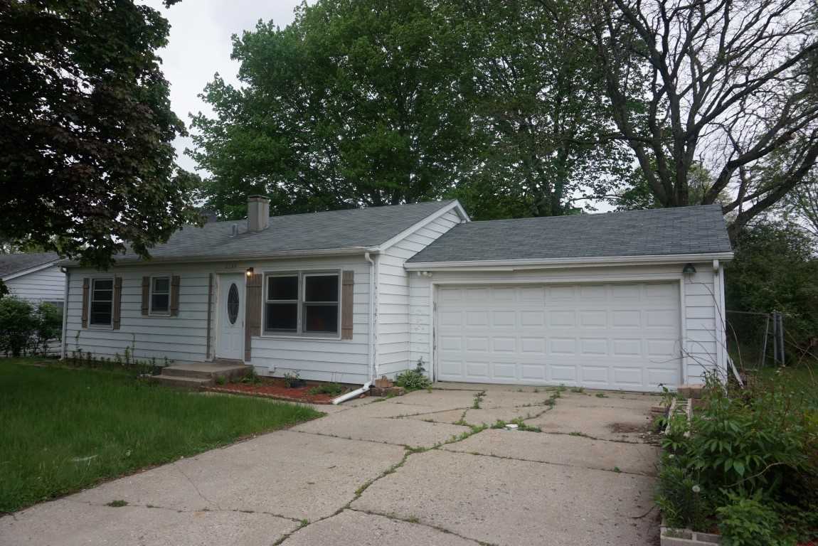 2105 North Alpine Road Rockford, IL 61107 - Photo 1 of 15 a front view of house with yard and trees