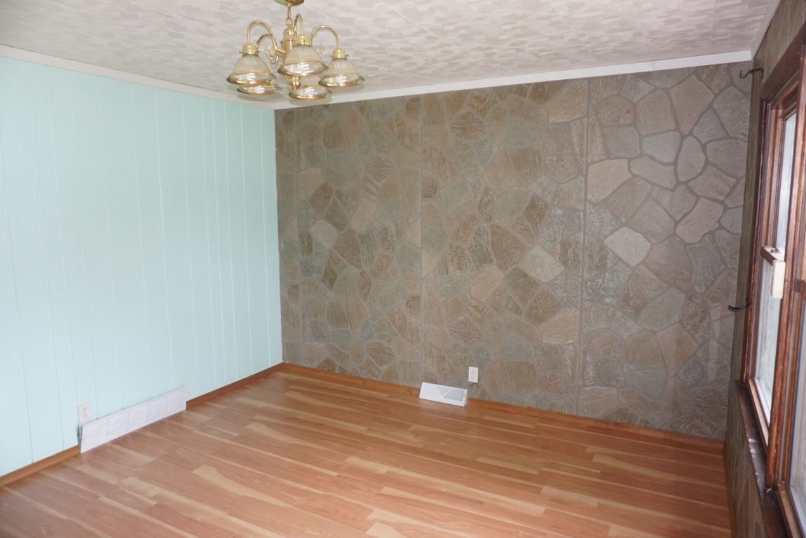 2105 North Alpine Road Rockford, IL 61107 - Photo 4 of 15 a view of a room with wooden floor and a window