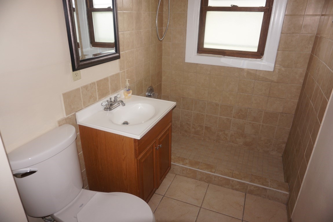 2105 North Alpine Road Rockford, IL 61107 - Photo 6 of 15 a bathroom with a sink mirror vanity and toilet