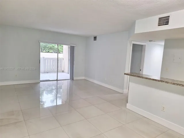 a kitchen with stainless steel appliances a sink and cabinets