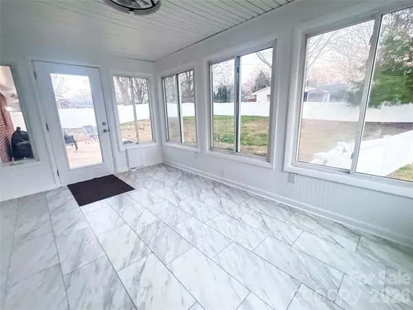 a view of an empty room and window