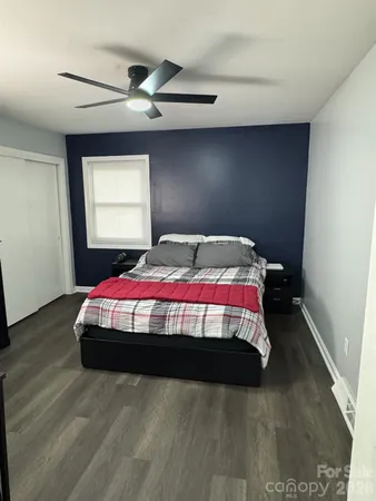 a bedroom with a bed and window