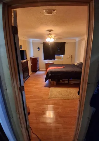 a bedroom with a bed and a mirror