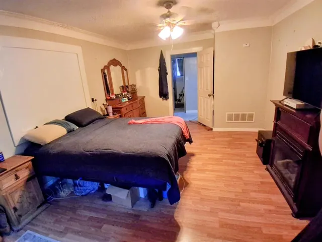 a bed room with a bed and a television