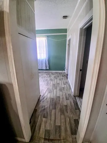 a view of room with window and furniture