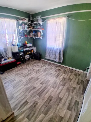 a view of a house with a swimming pool and a yard