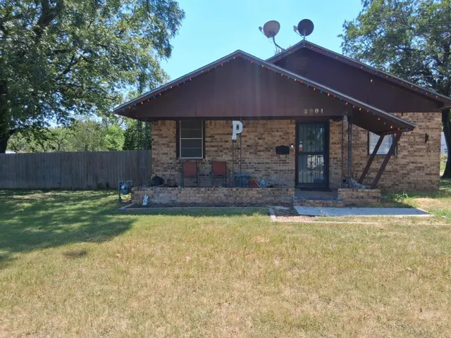 a view of a patio with a table and chairs