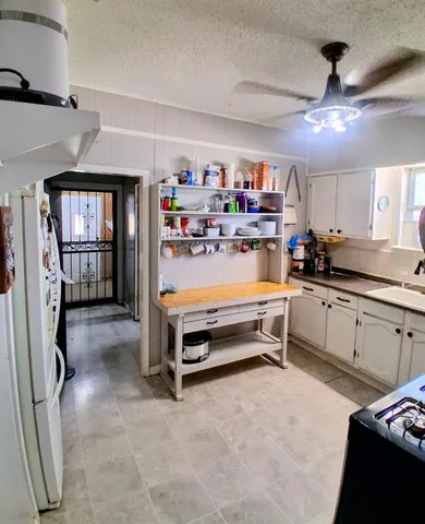 a kitchen with refrigerator and window