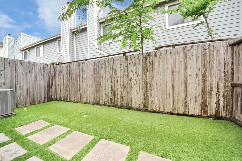 4222 Drake Street Houston, TX 77005 - Photo 26 of 28 a view of a backyard with wooden fence