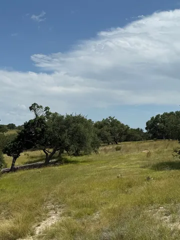 a view of lake with green space