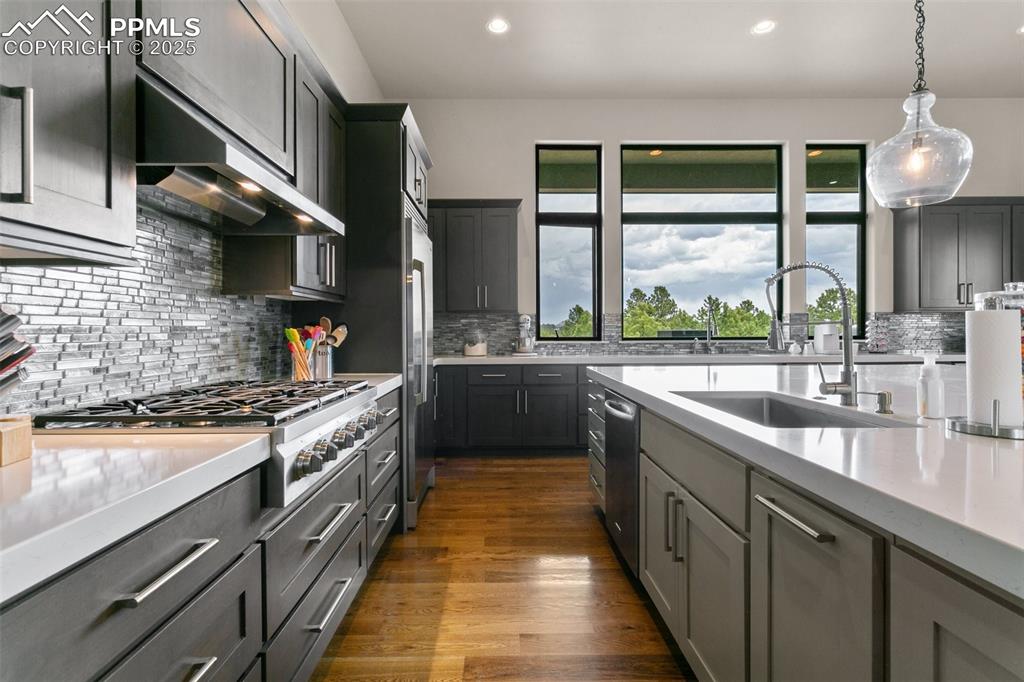 843 Long Timber Monument, CO 80132 - Photo 12 of 50 a kitchen with stainless steel appliances a sink stove and cabinets