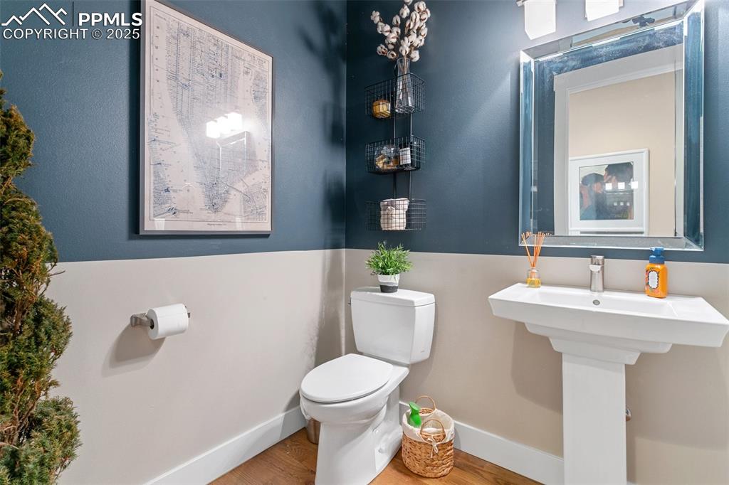 843 Long Timber Monument, CO 80132 - Photo 15 of 50 a bathroom with a toilet a sink and mirror