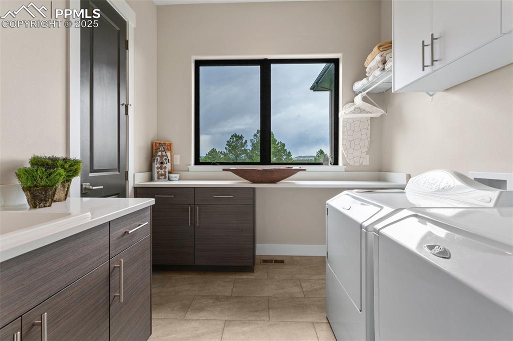843 Long Timber Monument, CO 80132 - Photo 16 of 50 a room with a sink and a washer dryer