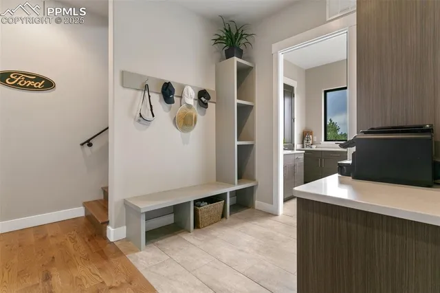 a view of kitchen with refrigerator and window