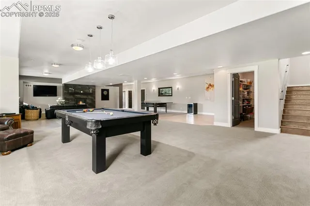 a living room with furniture and a table