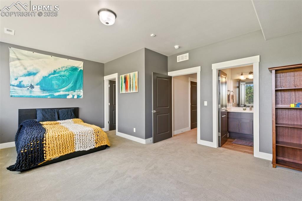 843 Long Timber Monument, CO 80132 - Photo 37 of 50 a bedroom with a bed and a large window