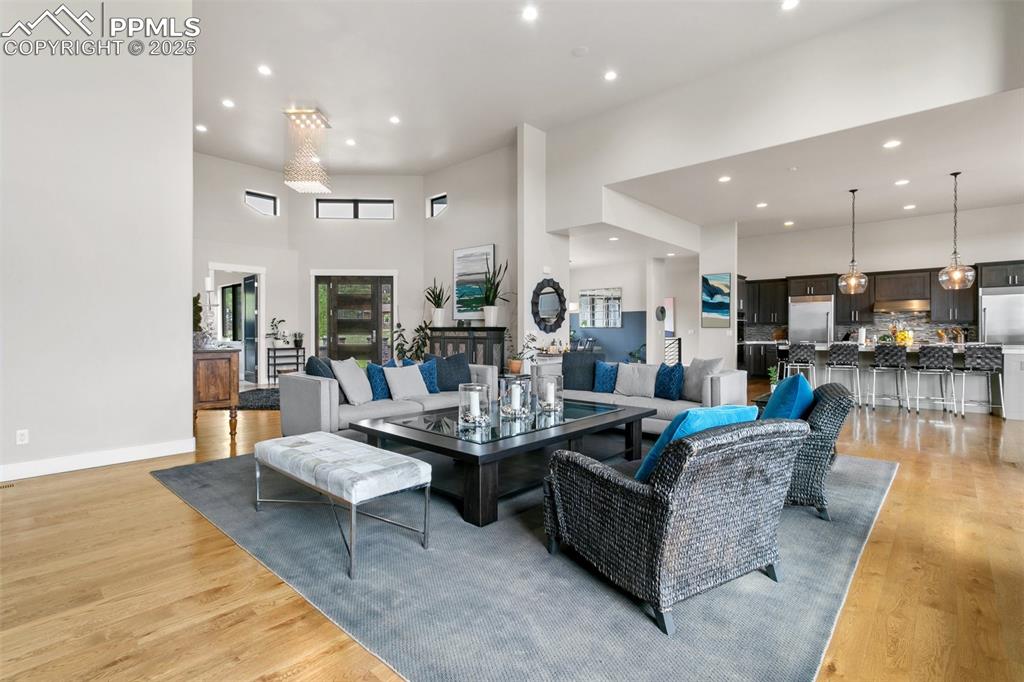 843 Long Timber Monument, CO 80132 - Photo 4 of 50 a living room with fireplace furniture and a wooden floor