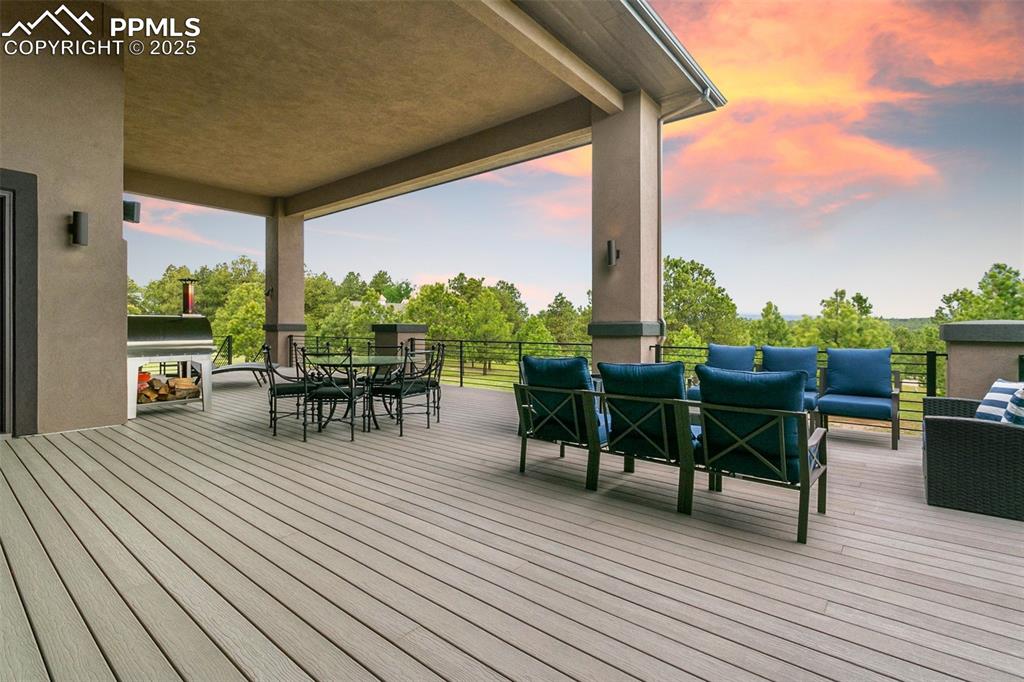 843 Long Timber Monument, CO 80132 - Photo 45 of 50 a view of a patio with dining table and chairs with wooden floor