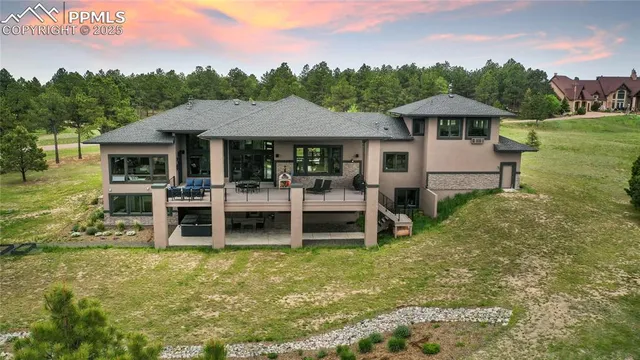 a view of a house with a yard porch and sitting area