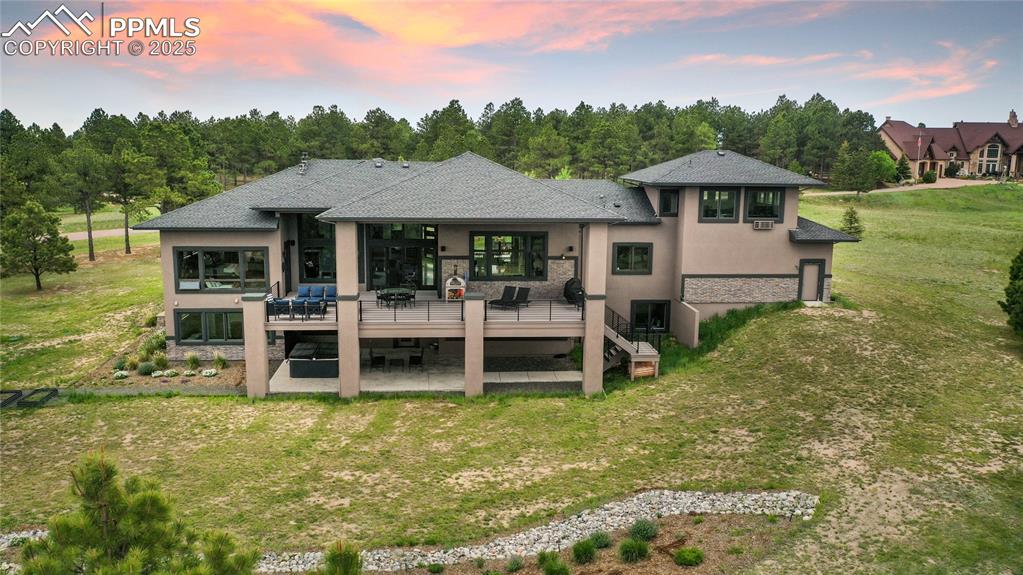 843 Long Timber Monument, CO 80132 - Photo 48 of 50 a view of a house with a yard porch and sitting area