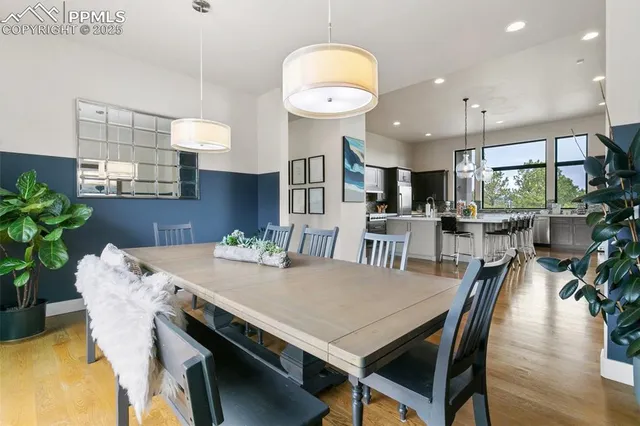 a view of a dining room with furniture and wooden floor