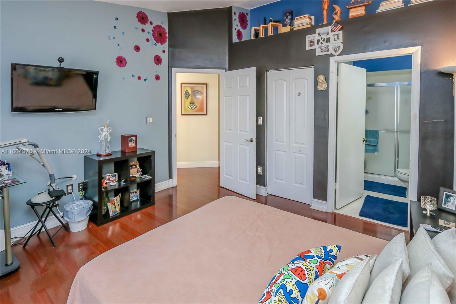 15253 Southwest 111th Street Miami, FL 33196 - Photo 13 of 32 a bedroom with a bed and a tv in it