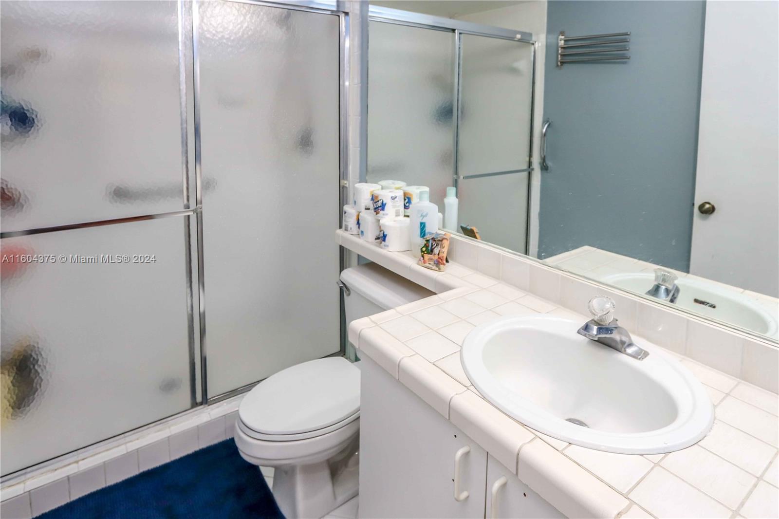 15253 Southwest 111th Street Miami, FL 33196 - Photo 14 of 32 a bathroom with a sink toilet and shower