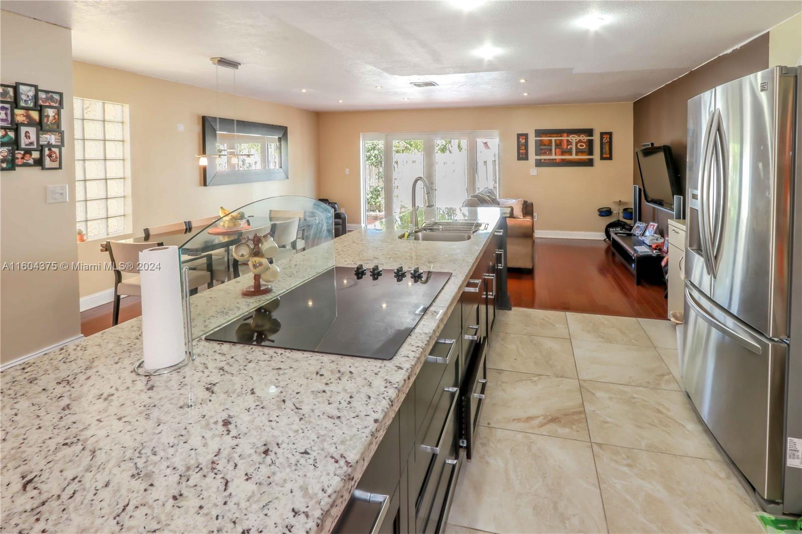 15253 Southwest 111th Street Miami, FL 33196 - Photo 16 of 32 a view of a dining room with furniture