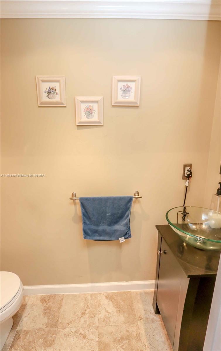 15253 Southwest 111th Street Miami, FL 33196 - Photo 18 of 32 a bathroom with a sink and a toilet