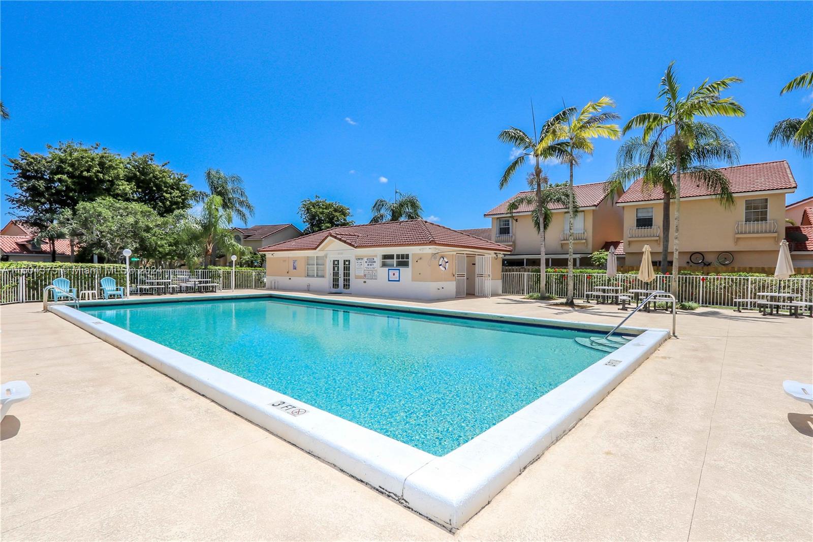 15253 Southwest 111th Street Miami, FL 33196 - Photo 28 of 32 a view of a swimming pool with a yard