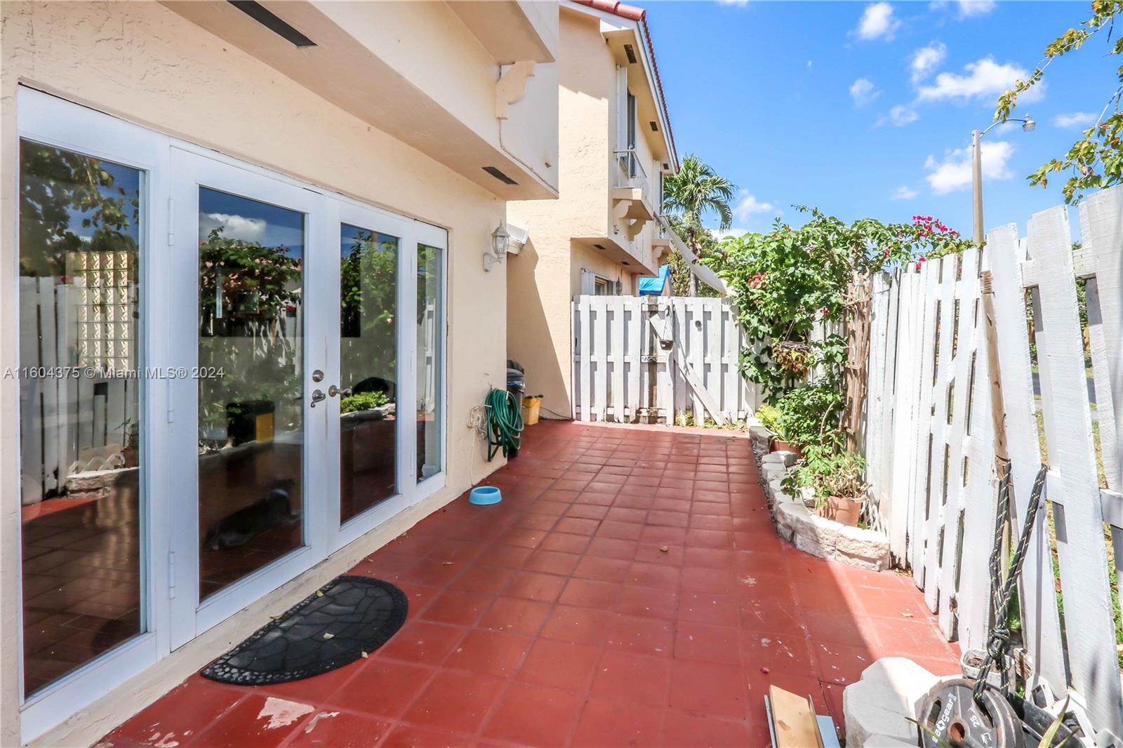 15253 Southwest 111th Street Miami, FL 33196 - Photo 4 of 32 a view of a garden with patio