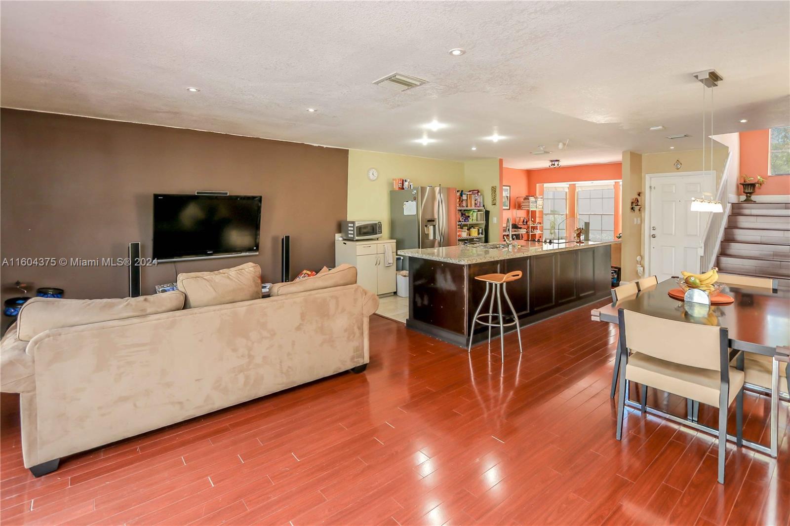 15253 Southwest 111th Street Miami, FL 33196 - Photo 5 of 32 a living room with furniture and a flat screen tv